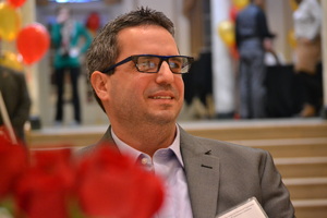 Man attending awards presentation