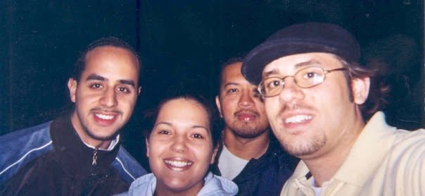 An image from 2025 of Joe Maldonado as a UW student. Joe is smiling alongside three other people against an indistinguishable dark background.
